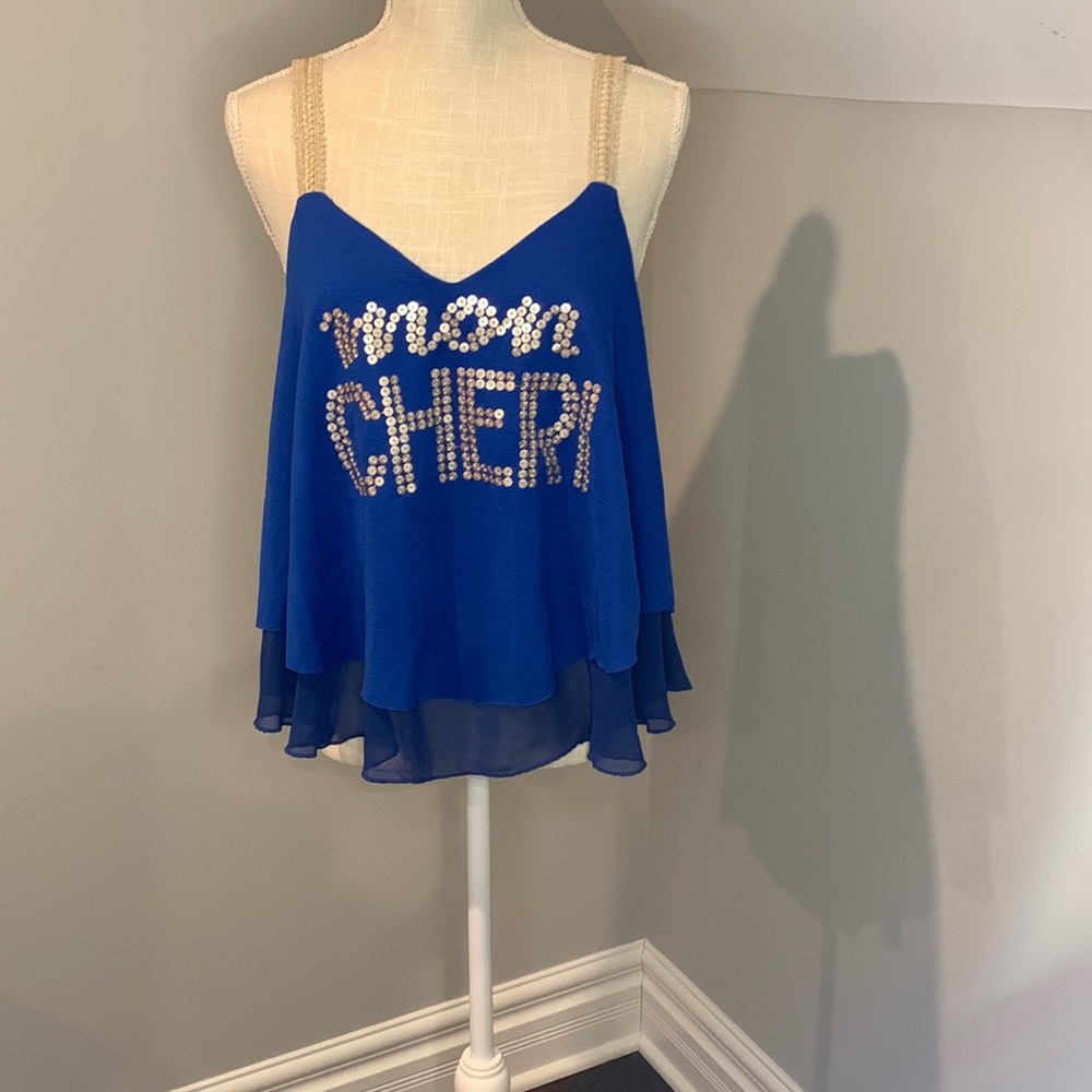 Woman’s top size 42, European blue, with golden straps